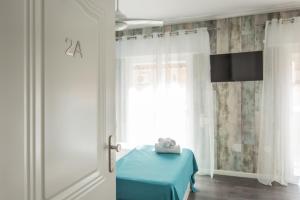 TV a/nebo společenská místnost v ubytování Sunsands Studio con balcones 2ºA playa76 Carihuela