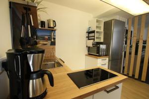 a kitchen with a coffee maker on a counter at Westerwald Apartment DRIE600 in Driedorf