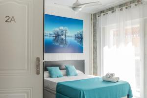 Postel nebo postele na pokoji v ubytování Sunsands Studio con balcones 2ºA playa76 Carihuela