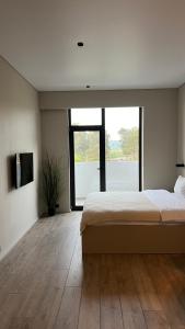 מיטה או מיטות בחדר ב-Dreamside Apartments