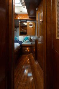 a small room with a bed and a mirror at Classic Boat Monte-Carlo in Monte Carlo