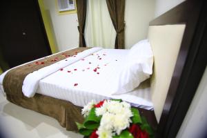 Postel nebo postele na pokoji v ubytování أندلسية الوسام + 4 fotografie