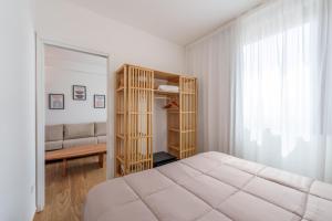 Кровать или кровати в номере Loft Olbia Centro
