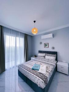 a bedroom with a large bed in a room at 1 Bedroom Design Apartment in Iskele North Cyprus in Iskele