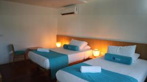 Postel nebo postele na pokoji v ubytování Hotel Rosario de Mar by Tequendama