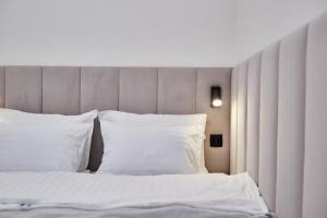 Postel nebo postele na pokoji v ubytování Apart Hotel Acropolis