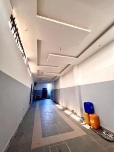 an empty hallway in an office building with luggage at Havre de paix in Cotonou