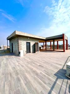 a building with a large patio with a sky at Havre de paix in Cotonou