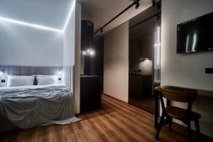 Postel nebo postele na pokoji v ubytování Apart Hotel Acropolis