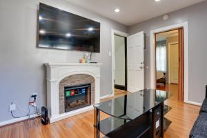 a living room with a fireplace and a tv at Cozy Condo about 11 Mi to Manhattan, Pets Welcome in Teaneck