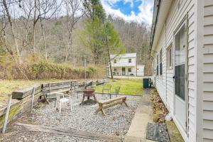 a group of benches next to a building at Spacious West Virginia Home Ride to ATV Trails! 