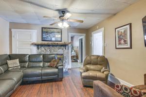 a living room with a couch and chairs and a fireplace at Spacious West Virginia Home Ride to ATV Trails! 
