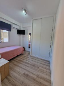 Postel nebo postele na pokoji v ubytování Virgen de Luján Triana