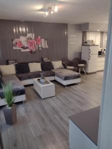 a living room with a couch and a table at Apartment AMare in Šibenik