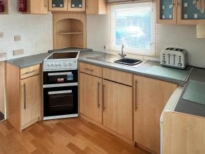 Kuchyň nebo kuchyňský kout v ubytování Carnaby - Uk47074