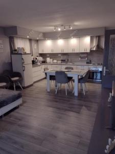 a large kitchen with a table and chairs in it at Apartment AMare in Šibenik +34 photos