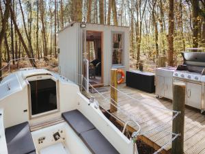a cabin on a boat with a stove at Chere Amie-qu7616 in Melton Constable