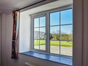 a window in a room with a view of a field at Bray View Cottage in Davidstow