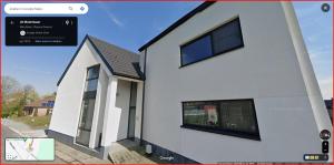 an image of a white house with a window at Molenbaan28 in Merchtem