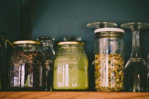 a row of glass jars filled with spices on a table at As Fuebas de Patricio in Vío