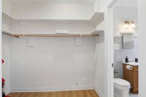 a bathroom with a toilet and a sink at Inviting Studio Apartment in Evanston - Elmgate Manor 403 in Evanston