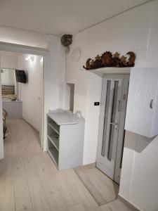 a kitchen with white walls and a white counter top at Brezza Marina in Riomaggiore