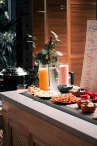 a buffet with food and drinks on a table at The Art Hotel Medellin in Medellín