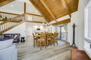 a dining room and living room with a table and chairs at Family Friendly Modern Cabin in Munds Park! in Munds Park