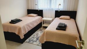 Giường trong phòng chung tại Apartment Boa Vista +28 ảnh