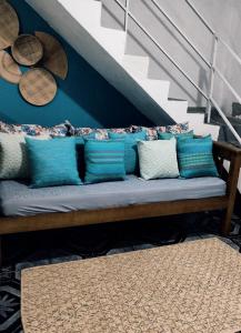 a bench with blue and white pillows on a staircase at AEROHOSTEL Brasil in Guarulhos