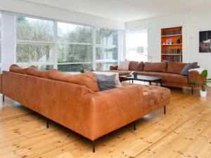 A seating area at 16 person holiday home in Ebeltoft