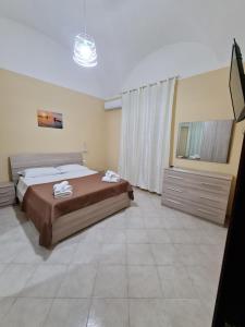 Ένα ή περισσότερα κρεβάτια σε δωμάτιο στο Sicilian Room