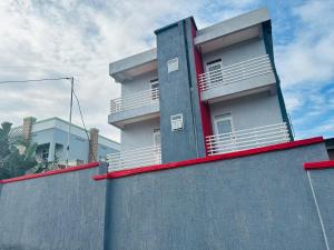 a building on top of a wall at Central Residence - 1 Bedroom Kigali in Kigali
