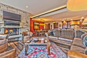 a living room with a couch and a fireplace at Year Round Recreation Luxury Resort Amenities and Hot Tub Access! Deer Valley Arrowleaf 211 in Park City