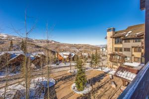 an aerial view of a town with snow covered mountains at Year Round Recreation Luxury Resort Amenities and Hot Tub Access! Deer Valley Arrowleaf 211 in Park City