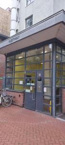 an entrance to a building with a bike parked outside at Fleetway Private Rooms in London