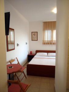 Giường trong phòng chung tại Apartments Mandić