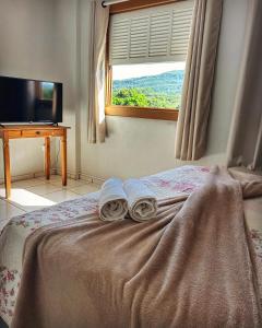 Una cama o camas en una habitación de Pousada Chafariz
