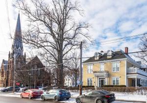 a group of cars parked in front of a church at Fitzroy Hall in Charlottetown