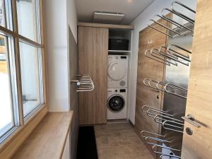 a laundry room with a washer and dryer at Haus Bente in Donnersbachwald