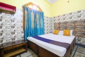 Vuode tai vuoteita majoituspaikassa SPOT ON Hotel Sagar