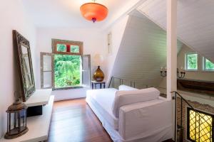 Postel nebo postele na pokoji v ubytování Cabana Boutique na Serra com piscina natural