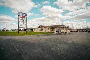 a parking lot with a k rite aid sign in front of a store at Faulds Motel in Sarnia