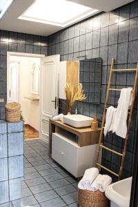 a bathroom with a sink and a toilet at Oltremare Suite N37 Villa fronte mare con spa privata giardino vista panoramica e wifi gratuito in Bagheria