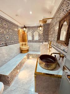 a bathroom with a bowl sink and a toilet at Wilaya Sunset Luxe, Private Jacuzzi & Hamam, Tetuan in Tétouan