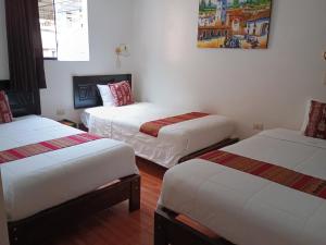 Cama ou camas em um quarto em Hostal killari Machupicchu