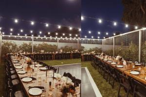 a long table set up for a wedding with lights at Luxury Micro-Resort, Theater, Sauna, Heated Pool in Phoenix