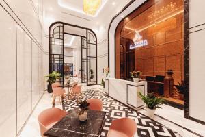 a lobby of a store with a table and chairs at Chuỗi Căn Hộ Khách Sạn Altara Residences Quy Nhơn in Quy Nhon