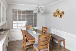 a dining room with a table and chairs at Houston Luxury 4br/3ba and Pool in Sugar Land