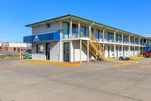 a building with a staircase in a parking lot at Americas Best Value Inn - Lincoln in Lincoln